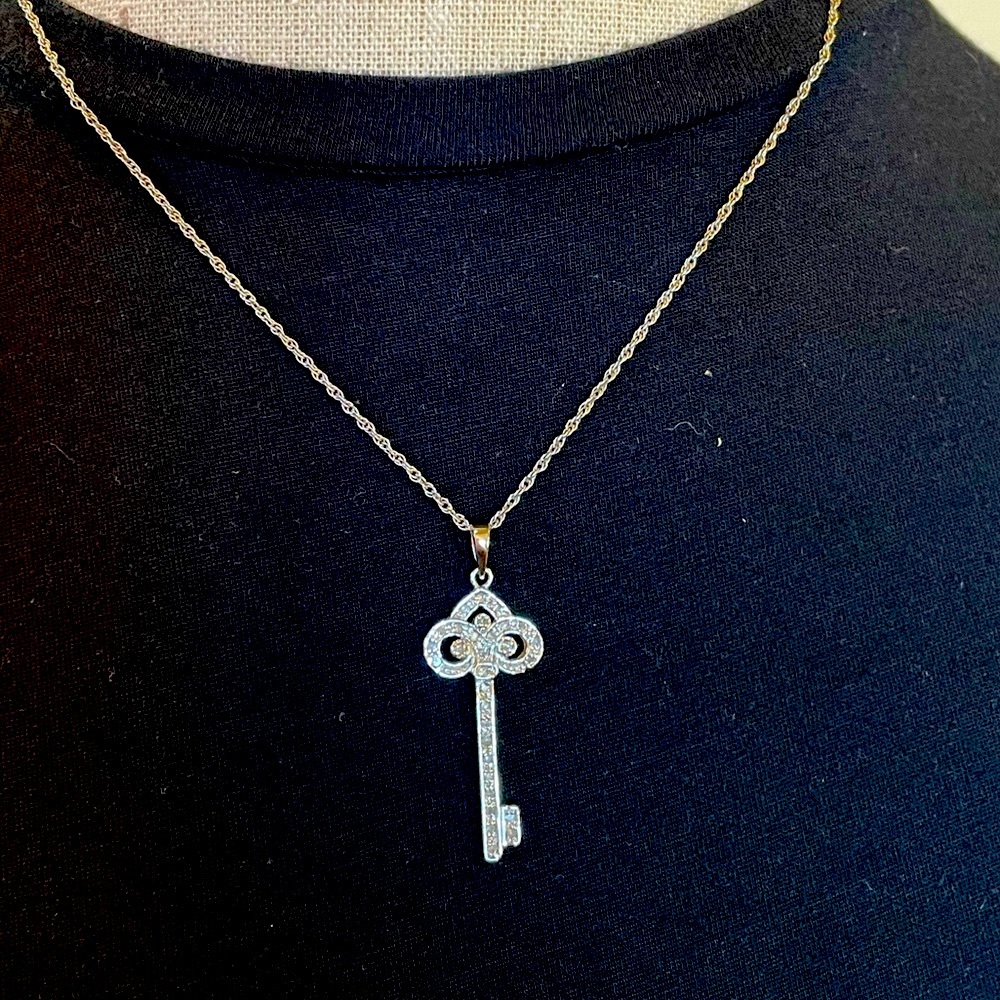 Like New 1/3CTW White Diamond Key Pendant